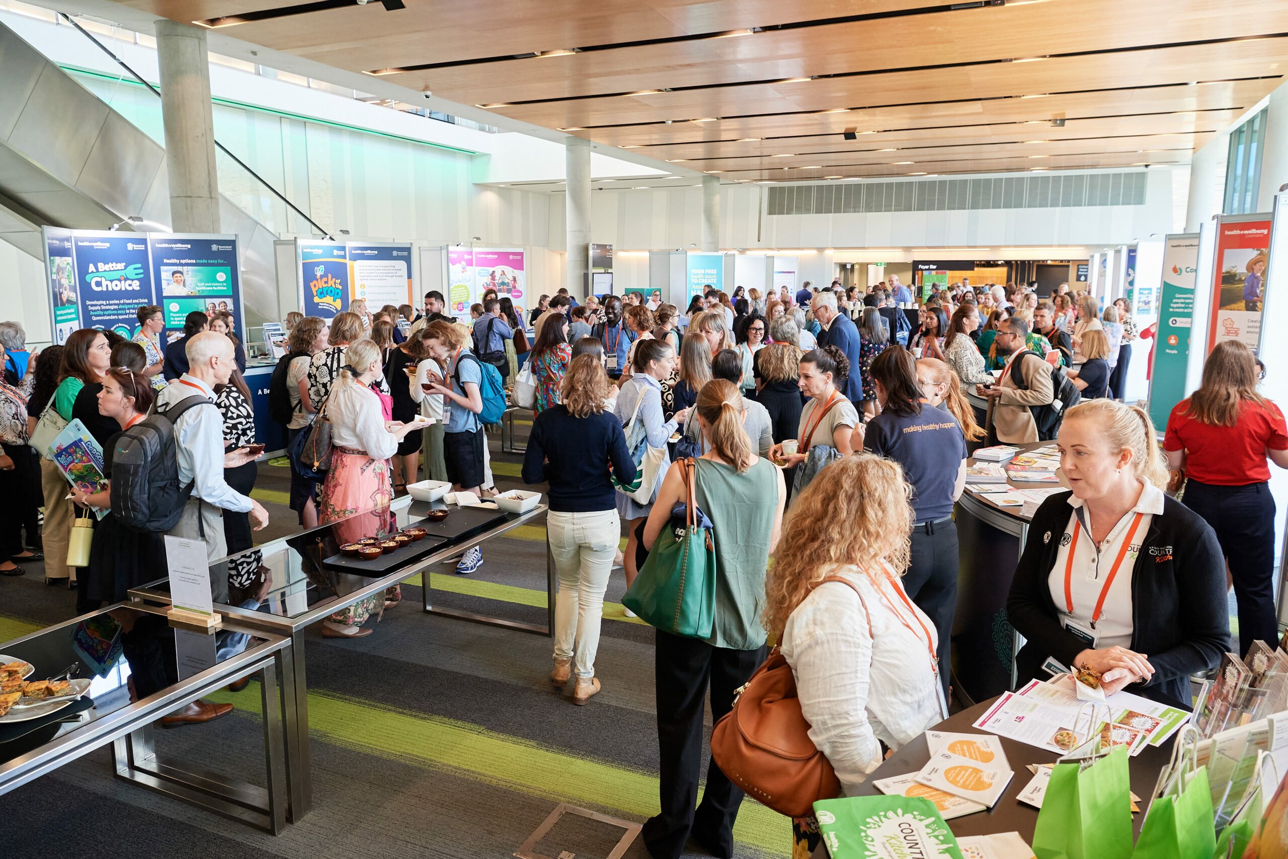 Symposium 2024 People mingle in the foyer of Brisbane Convention Centre