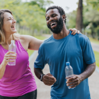 Two people walking in a park